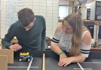 Two young people taking part in an engineering project
