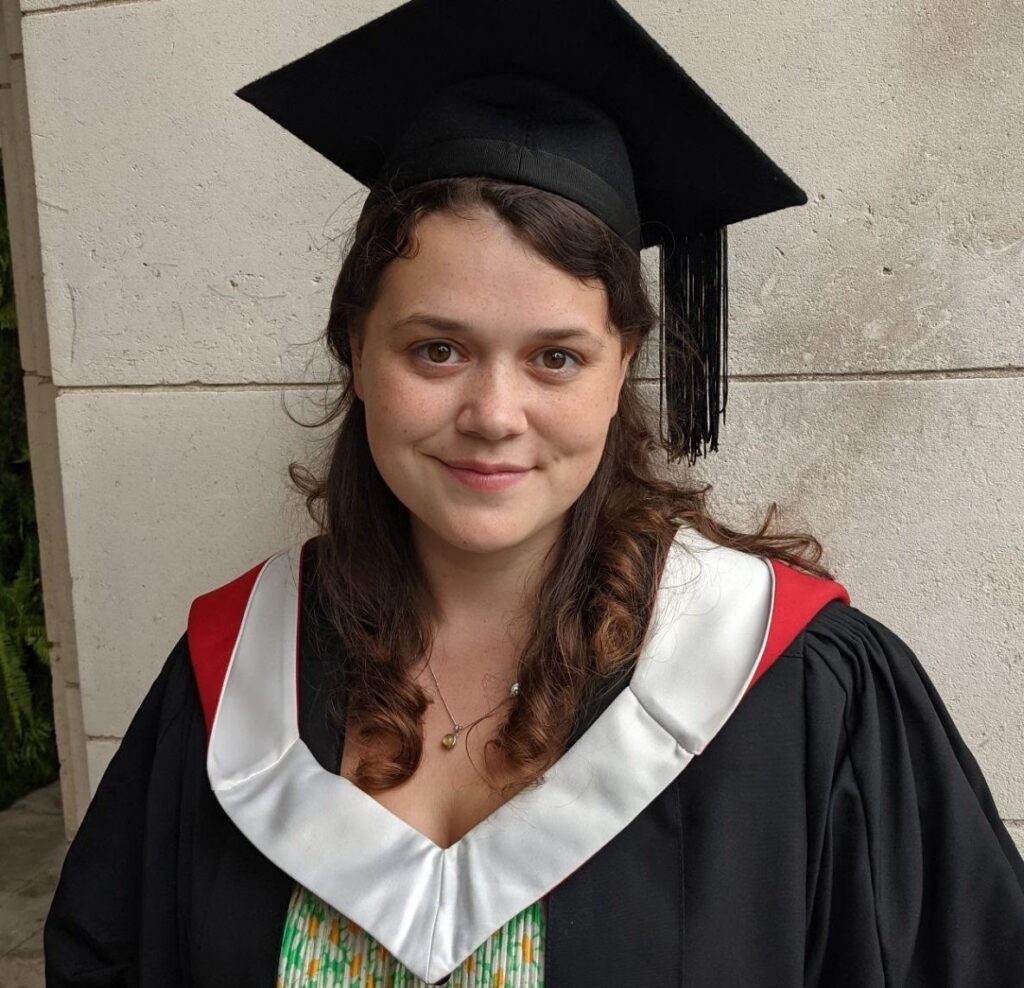 Photo of a female in post graduate gown